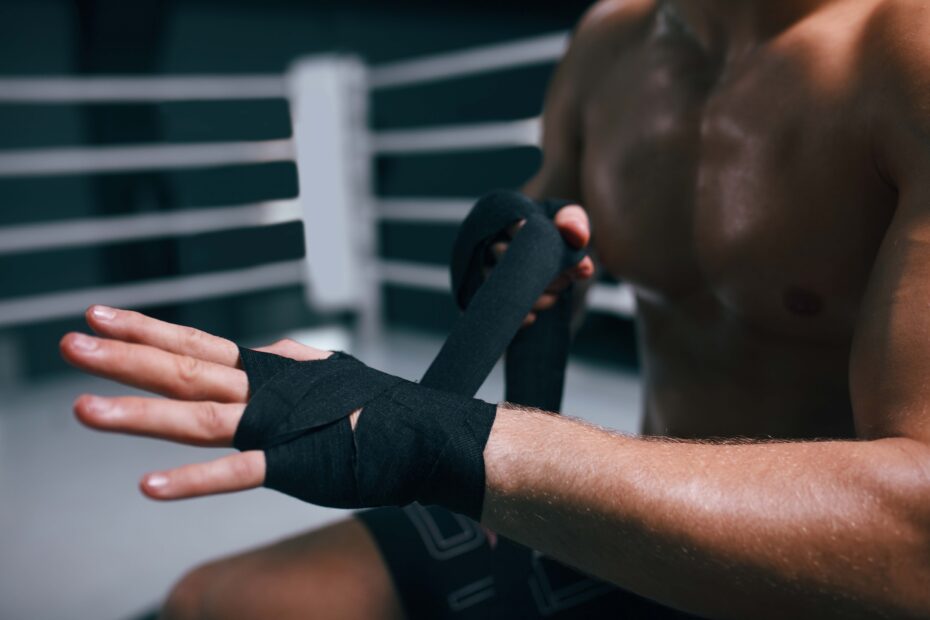 A man wearing parkour gloves for difficult practice movements.