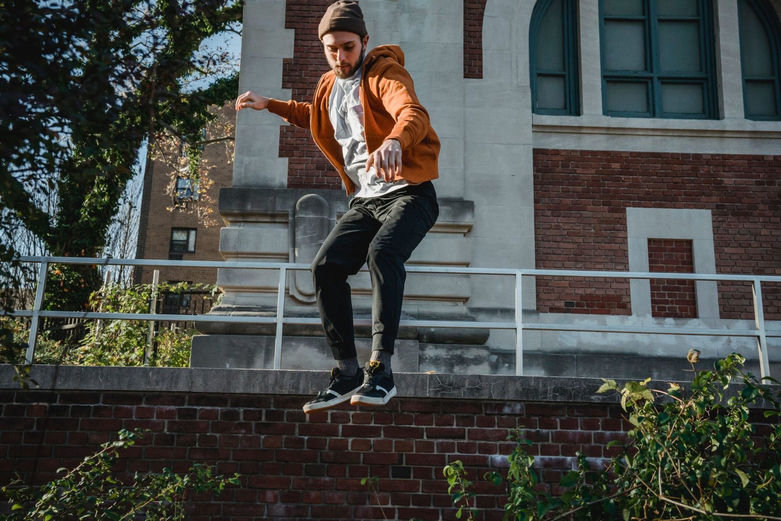 A traceur training on an urban structure, demonstrating controlled technique.